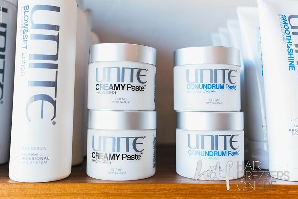 Unite hair products on a shelf.