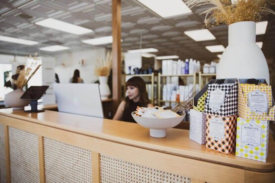 Woman behind reception desk