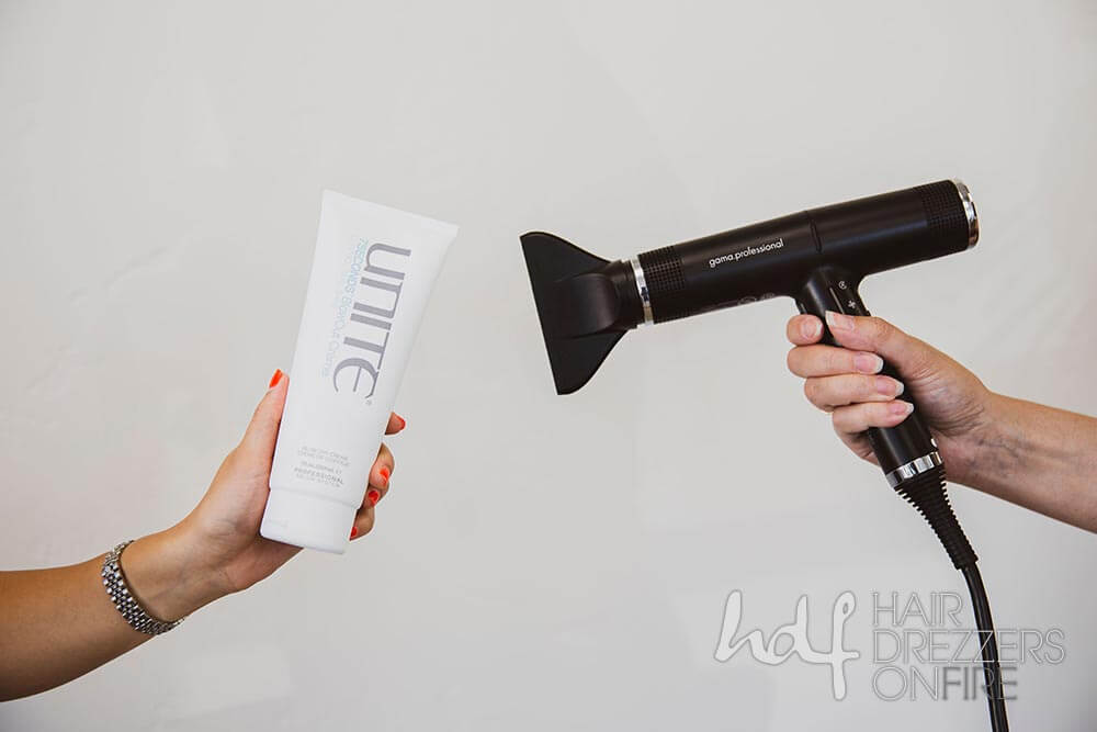 A hair dryer and a tube of a Unite hair care product